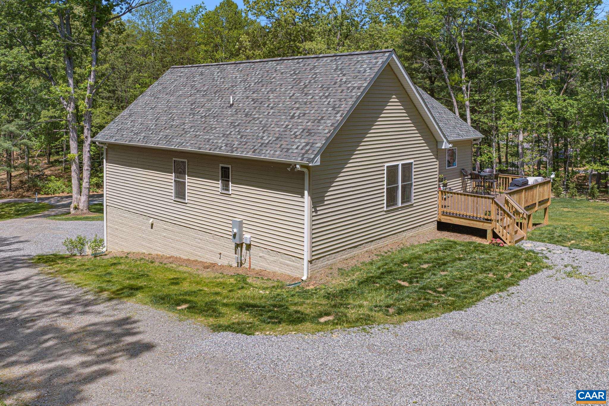 230 Fox Hollow Road Ruckersville, VA 22968 - Photo 40 of 42 a view of a house with a yard
