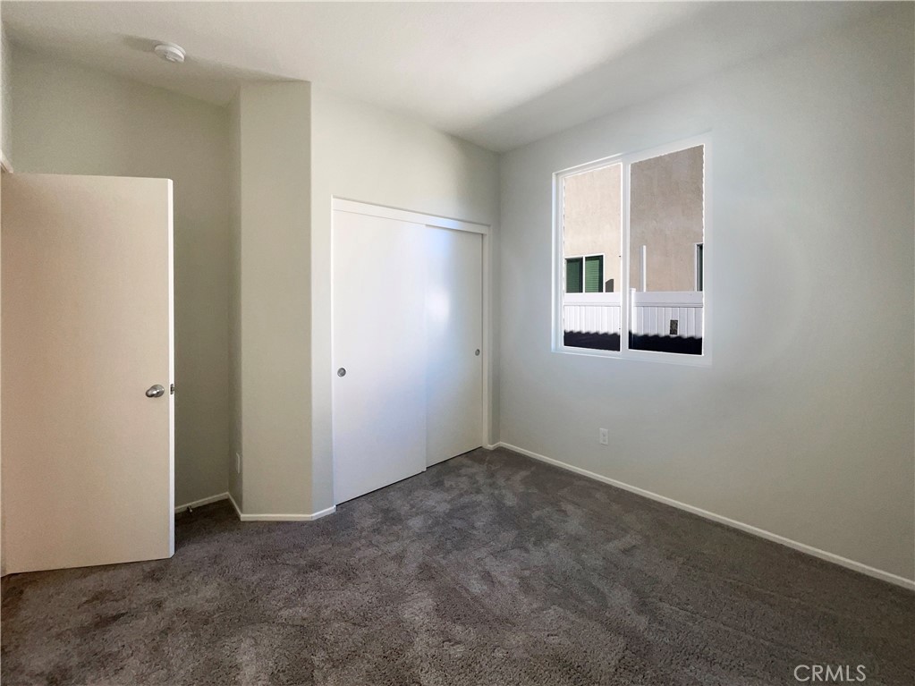 26625 Emperor Road Menifee, CA 92585 - Photo 11 of 24 an empty room with a mirror
