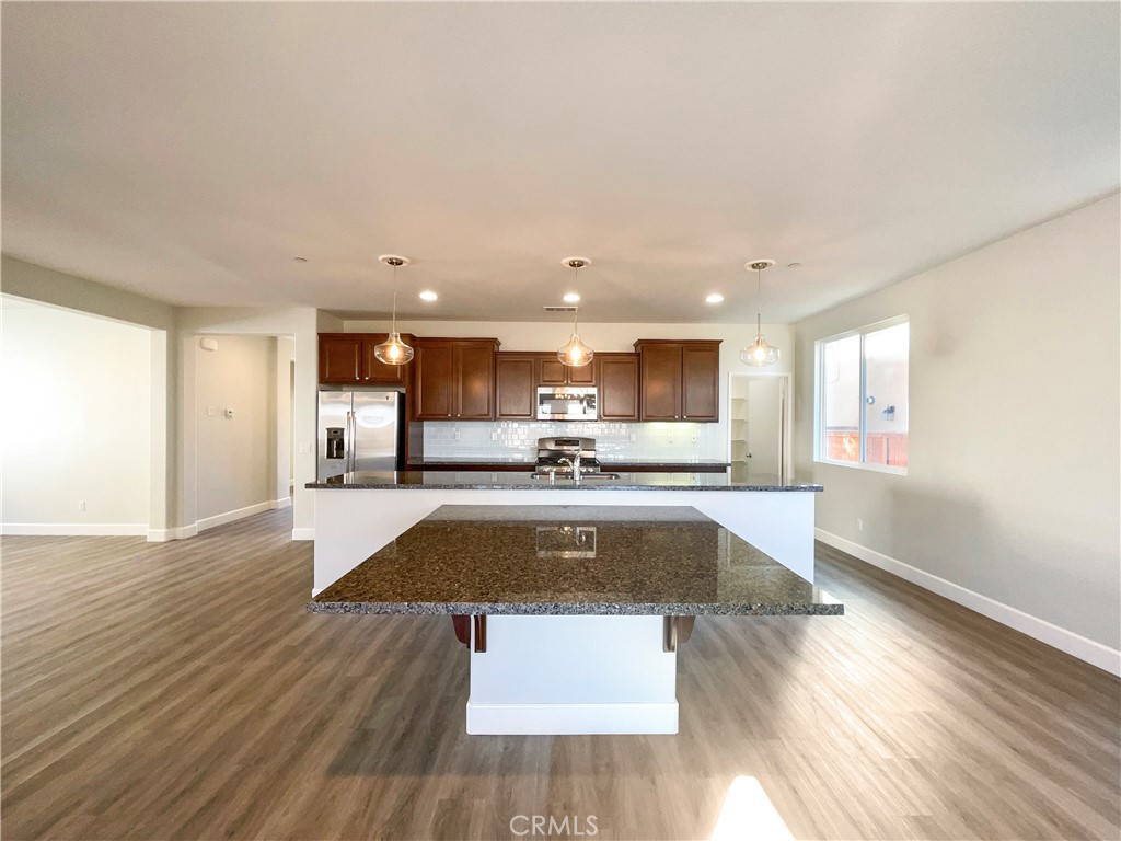 26625 Emperor Road Menifee, CA 92585 - Photo 16 of 24 a view of kitchen with wooden floor and center island