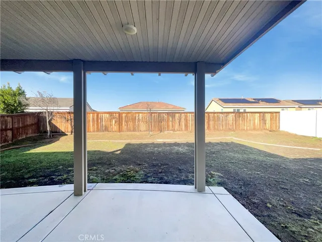 a house view with a backyard space