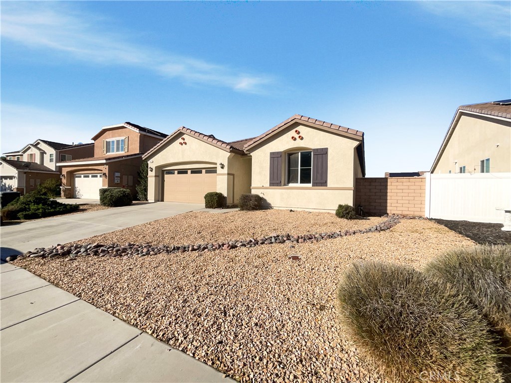 26625 Emperor Road Menifee, CA 92585 - Photo 7 of 24 a front view of a house with a yard