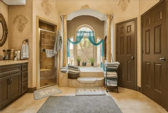 a living room with a table chairs and a painting on the wall