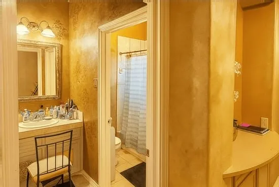 a bathroom with a sink a mirror and a shower