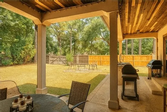 a view of a chairs and table in balcony