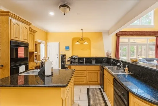 a kitchen with a large window and a sink