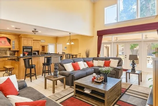 a living room with furniture and a table