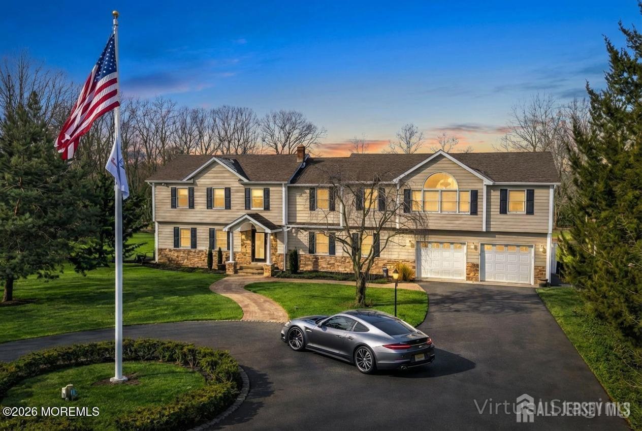 a car parked in front of a white house