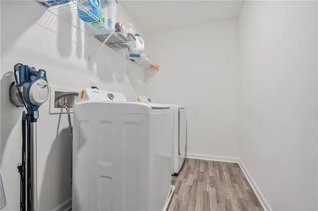 a close view of a utility room with dryer and washer
