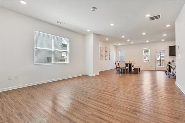 a view of kitchen and dining room with wooden floor