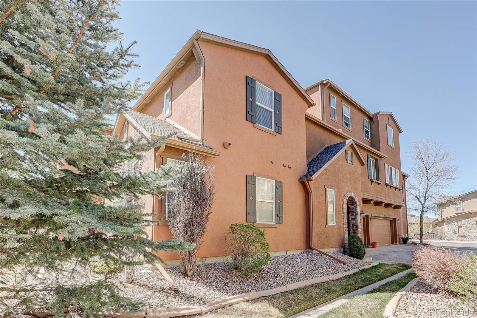 10556 Graymont Lane, Unit B Highlands Ranch, CO 80126 - Photo 1 of 40 a front view of a house with a yard