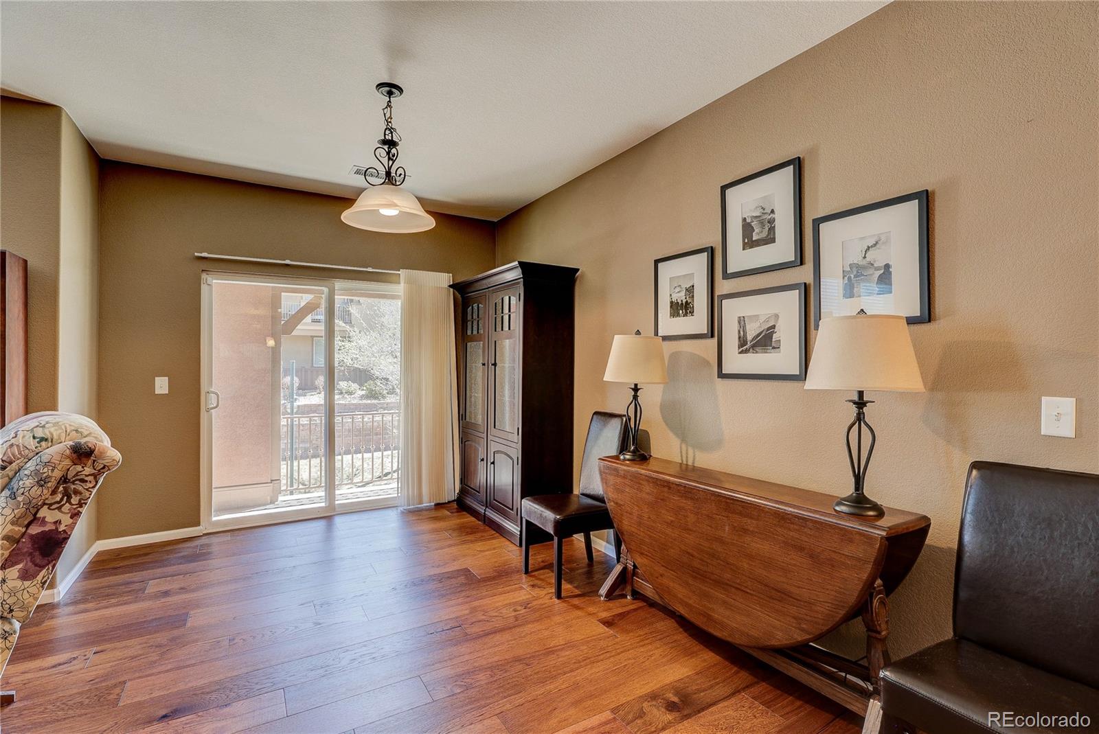10556 Graymont Lane, Unit B Highlands Ranch, CO 80126 - Photo 11 of 40 a living room with furniture and wooden floor