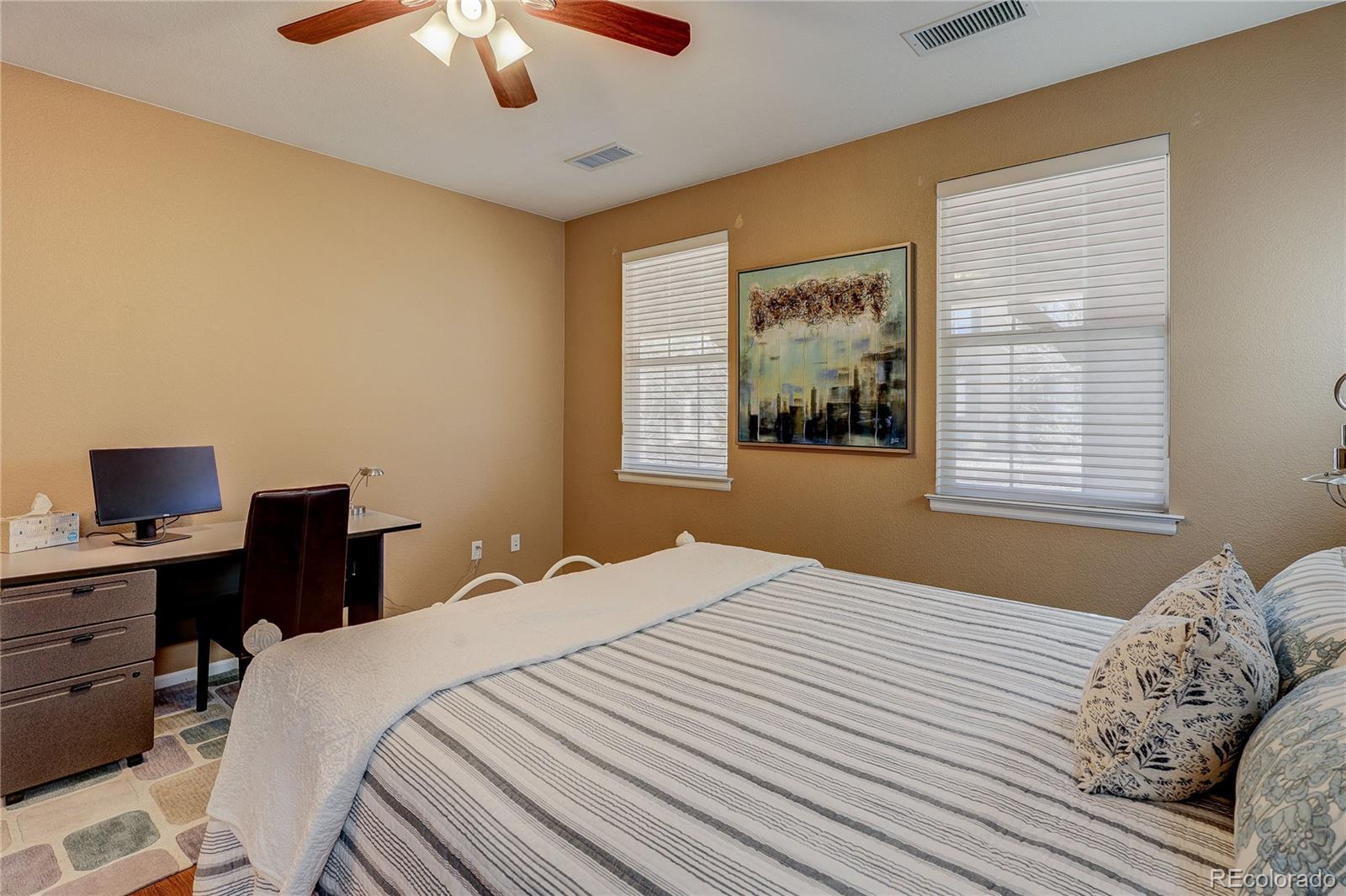 10556 Graymont Lane, Unit B Highlands Ranch, CO 80126 - Photo 23 of 40 a bedroom with a bed and a window