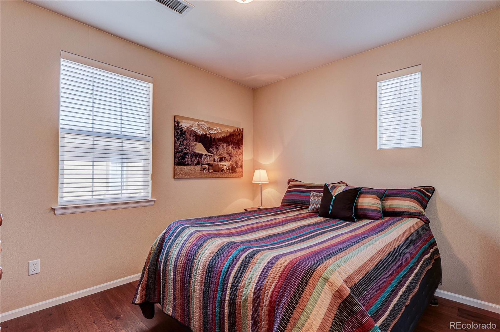 10556 Graymont Lane, Unit B Highlands Ranch, CO 80126 - Photo 27 of 40 a bedroom with double bed and a window