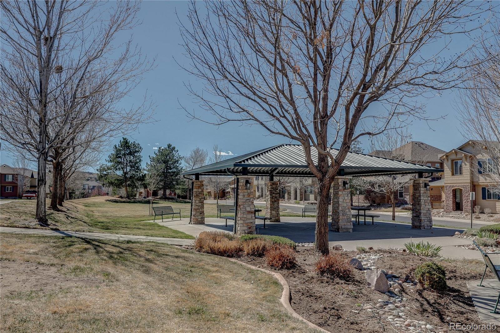 10556 Graymont Lane, Unit B Highlands Ranch, CO 80126 - Photo 39 of 40 a view of a building with trees