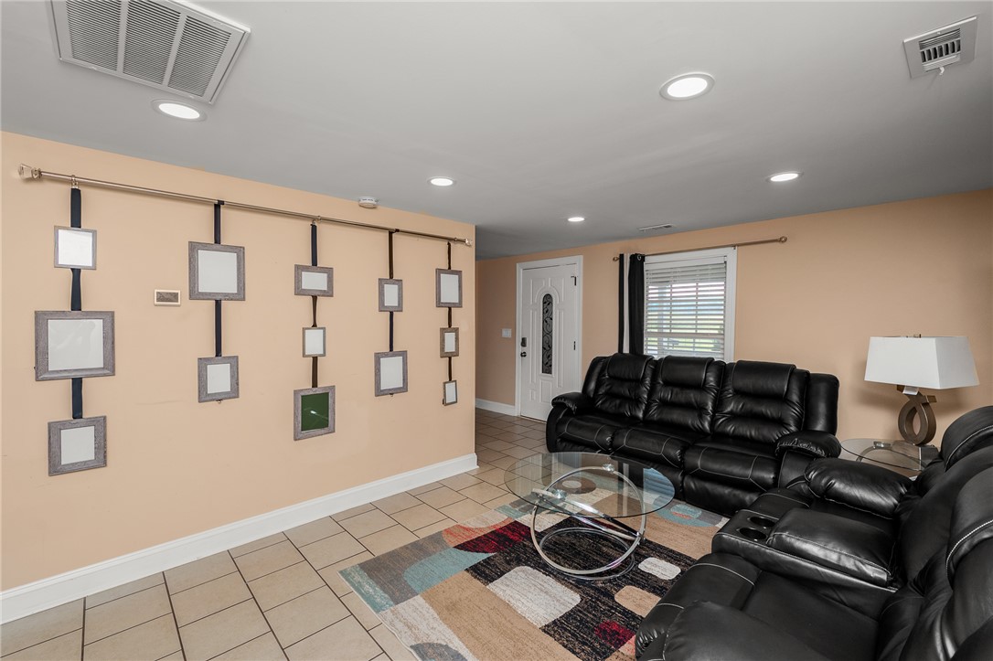 358 Finley Road Easley, SC 29642 - Photo 4 of 20 Bright and airy living room with recessed lighting and tiled flooring.