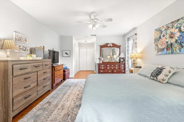 a large bedroom with a bed and a cabinets