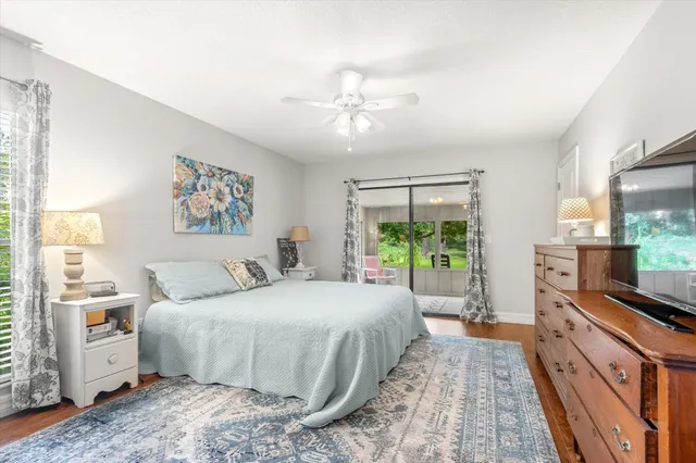 a bedroom with a large bed and a large window