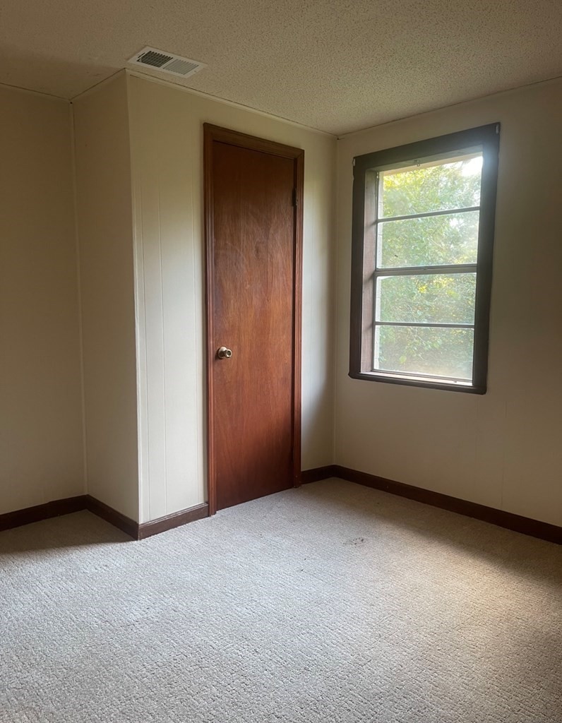 457 River Road Chatsworth, GA 30705 - Photo 7 of 18 an empty room with a window