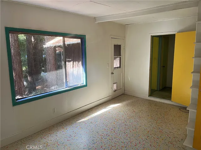 a view of a room with a large window