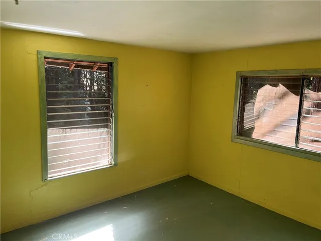 a view of a room that has a window in it