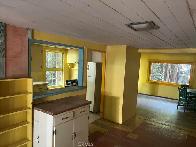 a kitchen with a sink appliances and cabinets