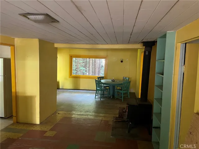 a view of a livingroom with furniture and a window