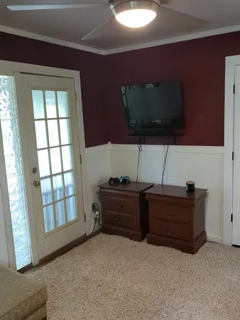 a room with furniture and flat screen tv