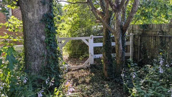 a backyard of a house with lots of green space
