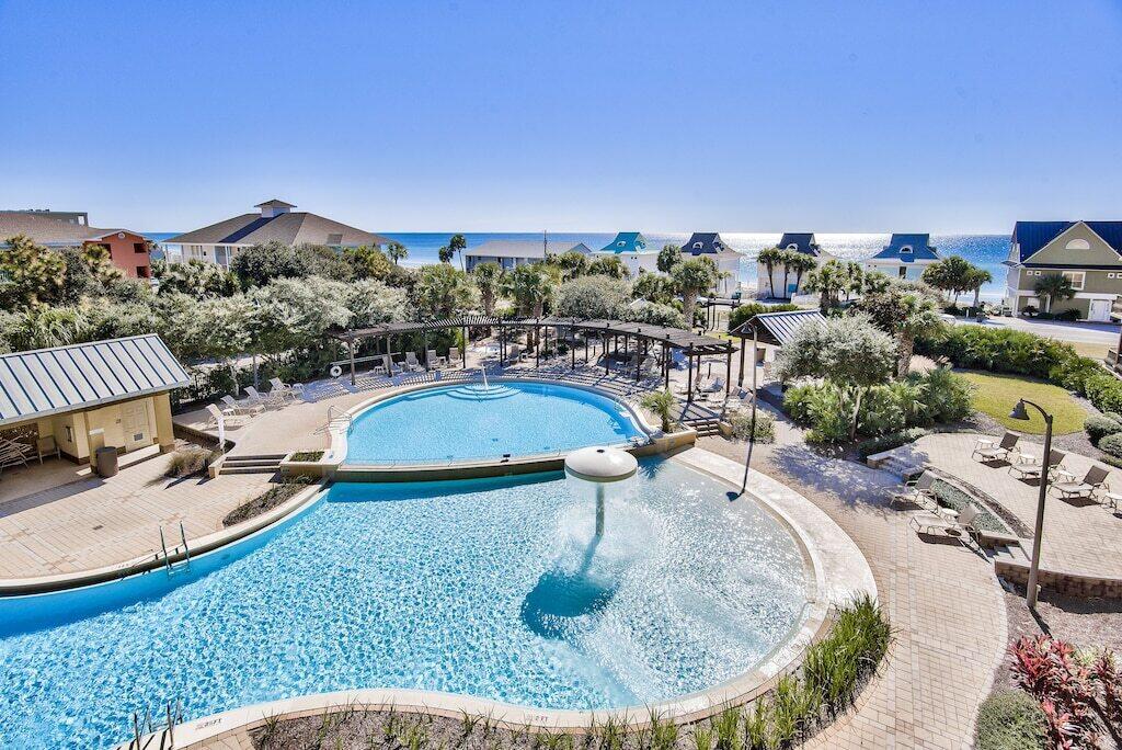 swimming pool view with a seating space