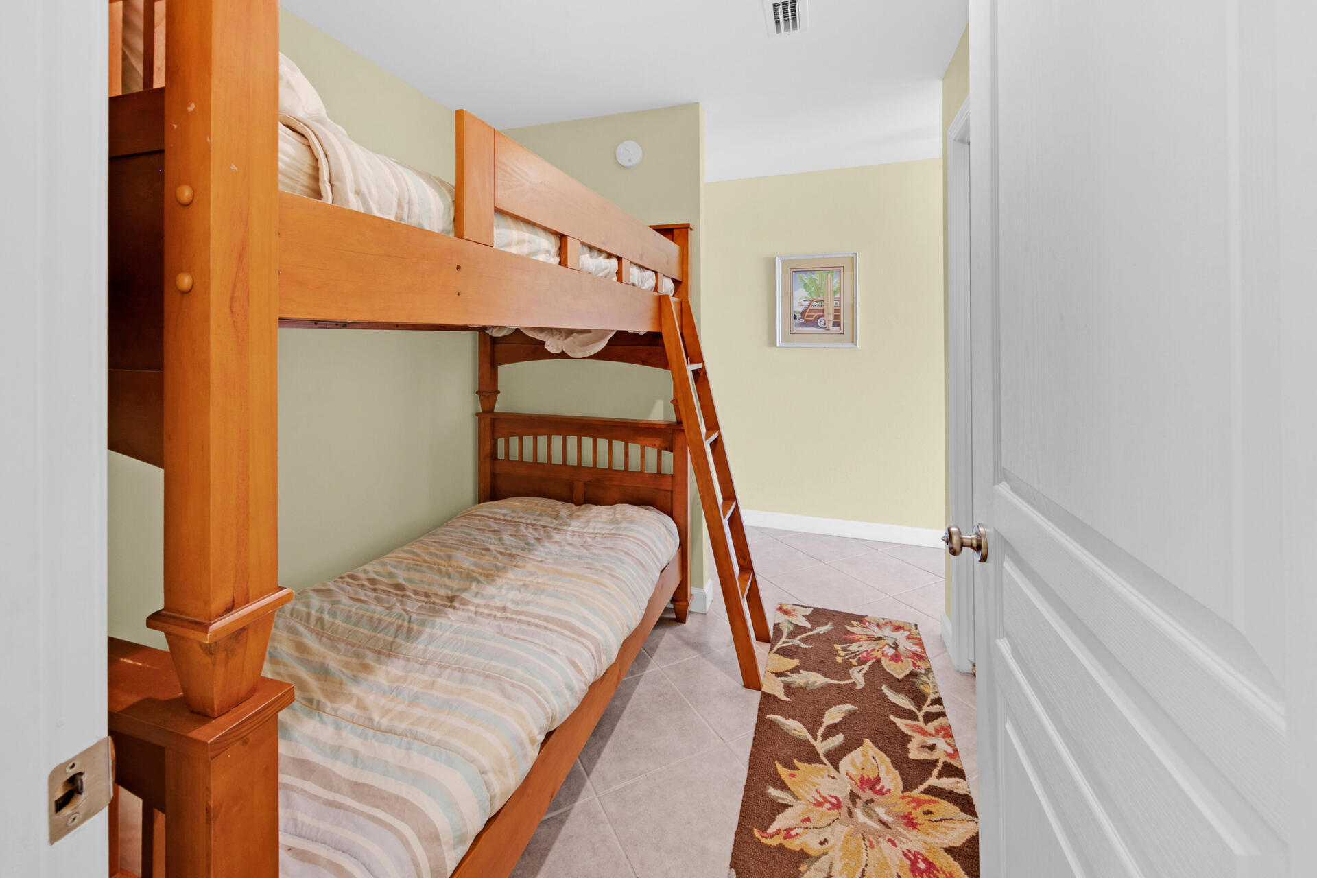 548 Sandy Cay Drive, Unit 309 Miramar Beach, FL 32550 - Photo 15 of 47 a bedroom with a bed and wooden floor