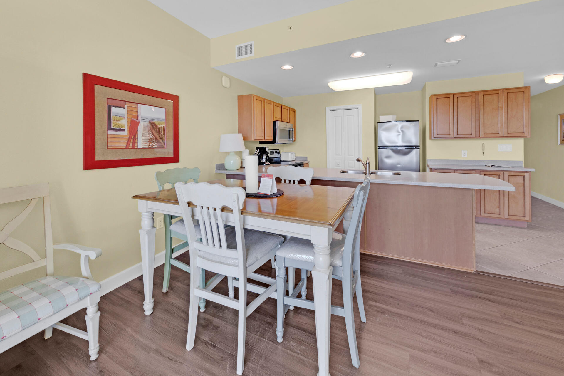 548 Sandy Cay Drive, Unit 309 Miramar Beach, FL 32550 - Photo 21 of 47 a view of a dining room with furniture wooden floor and kitchen