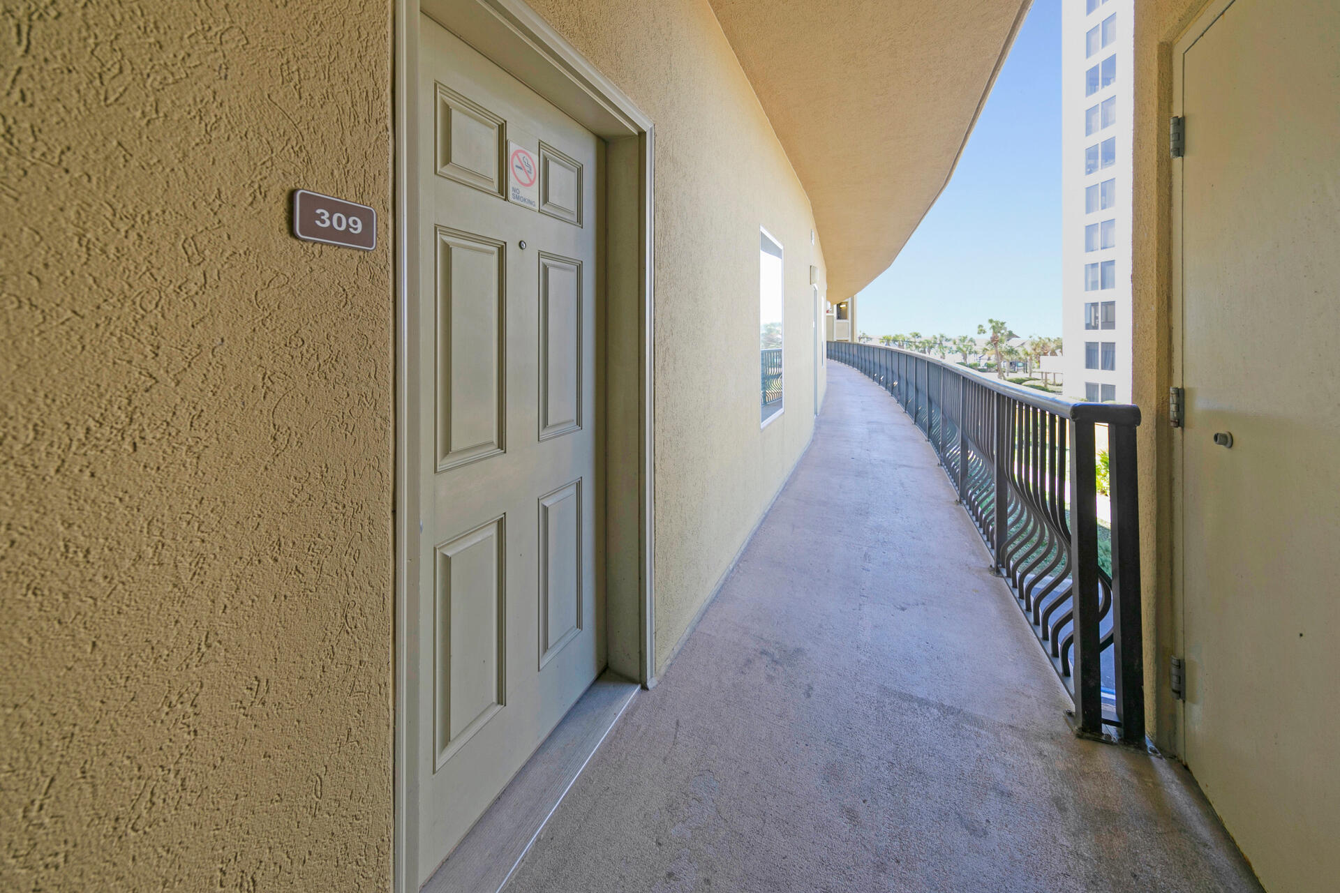 548 Sandy Cay Drive, Unit 309 Miramar Beach, FL 32550 - Photo 3 of 47 a view of a hallway with wooden floor and staircase
