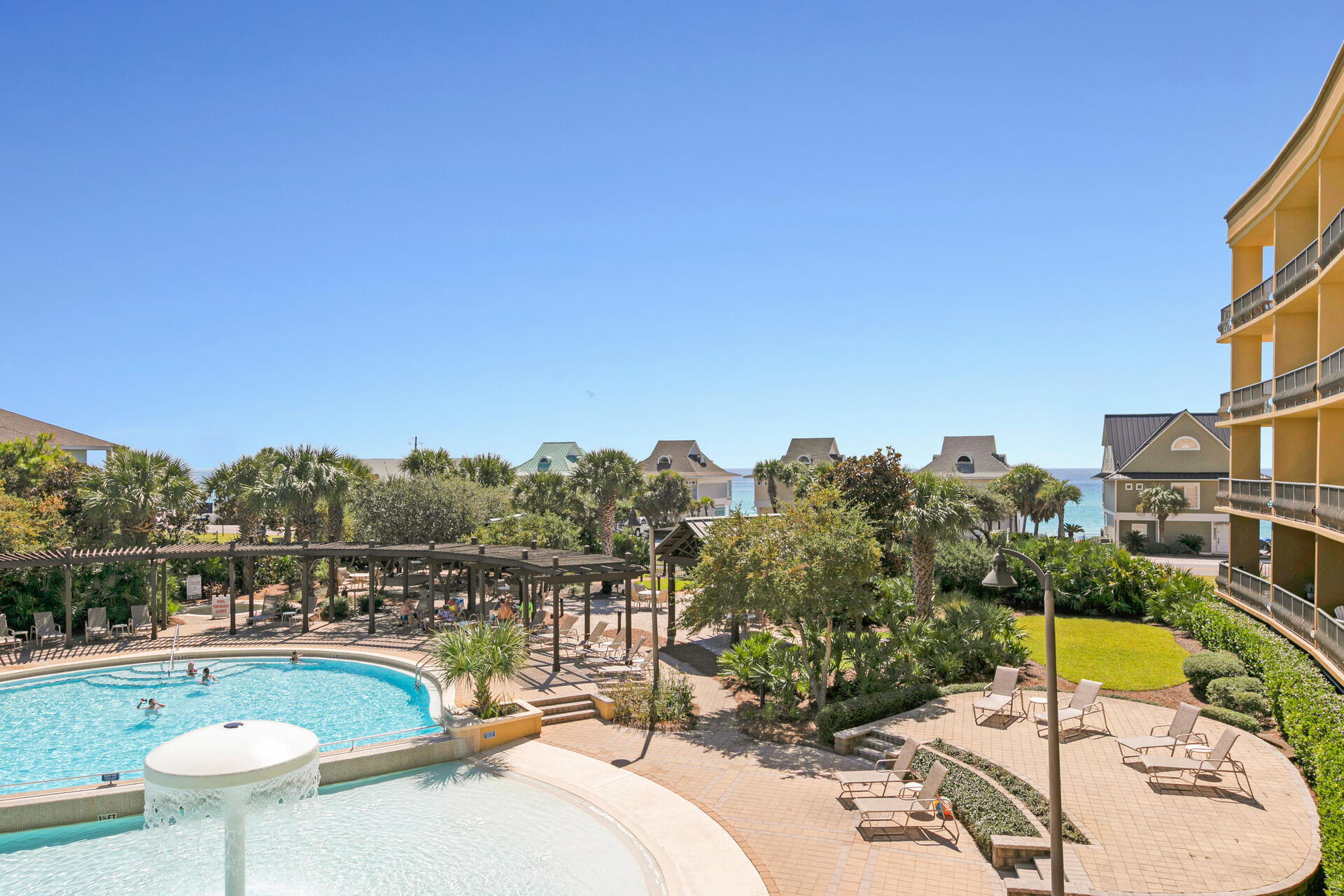 548 Sandy Cay Drive, Unit 309 Miramar Beach, FL 32550 - Photo 31 of 47 a view of a swimming pool and a chairs