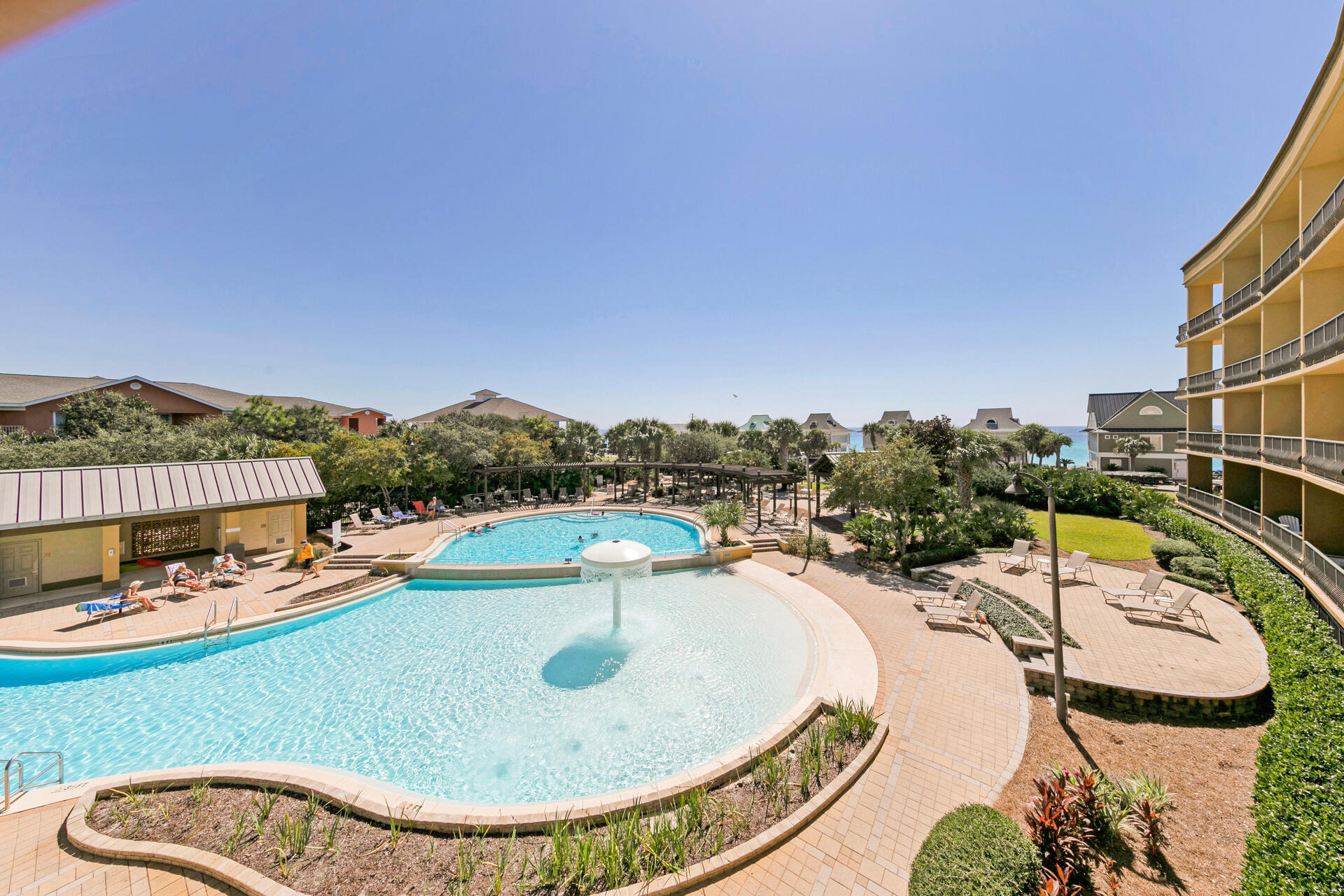 548 Sandy Cay Drive, Unit 309 Miramar Beach, FL 32550 - Photo 32 of 47 an aerial view of a swimming pool patio and lake view