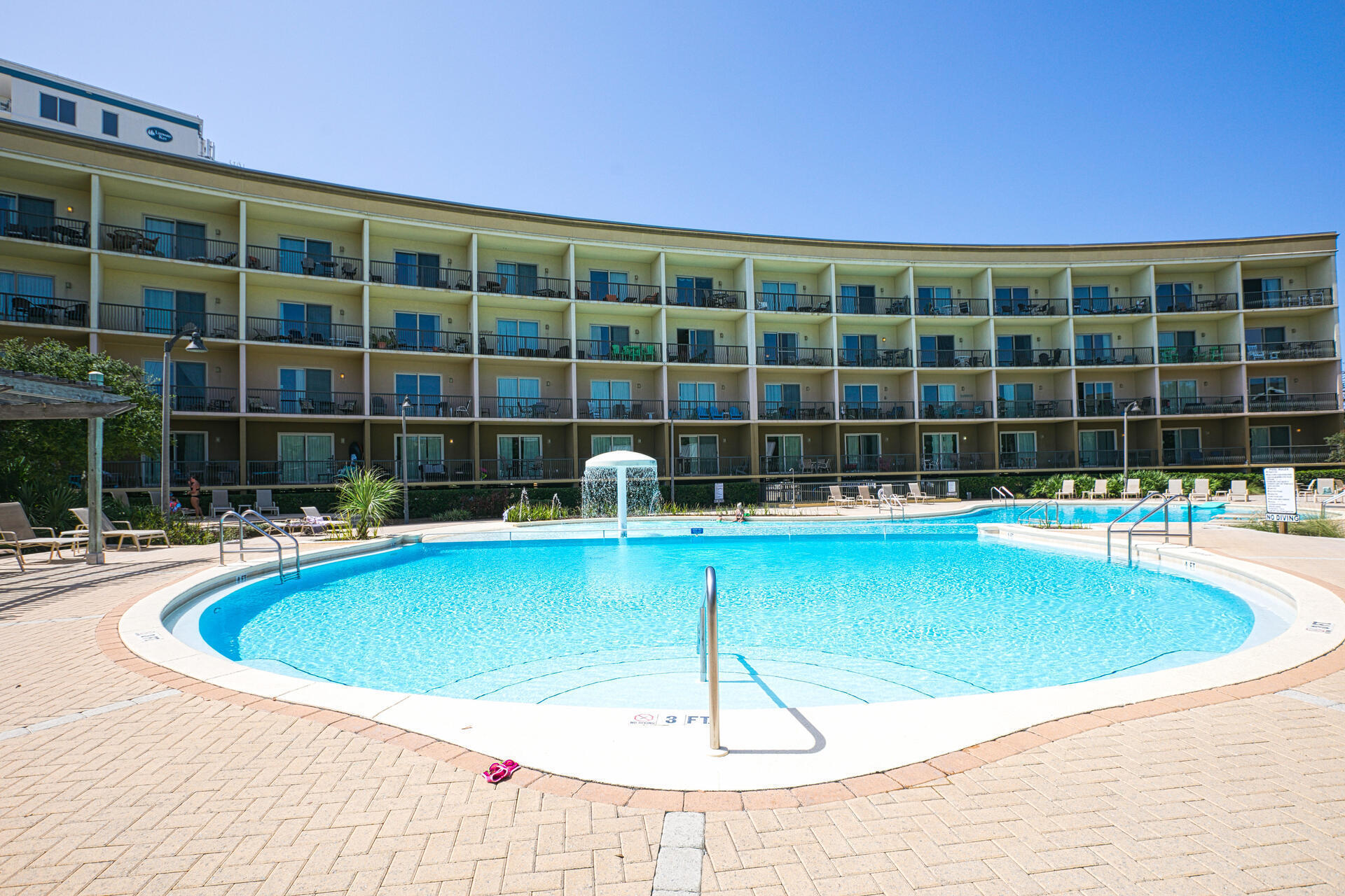 548 Sandy Cay Drive, Unit 309 Miramar Beach, FL 32550 - Photo 43 of 47 a view of a swimming pool with a chair