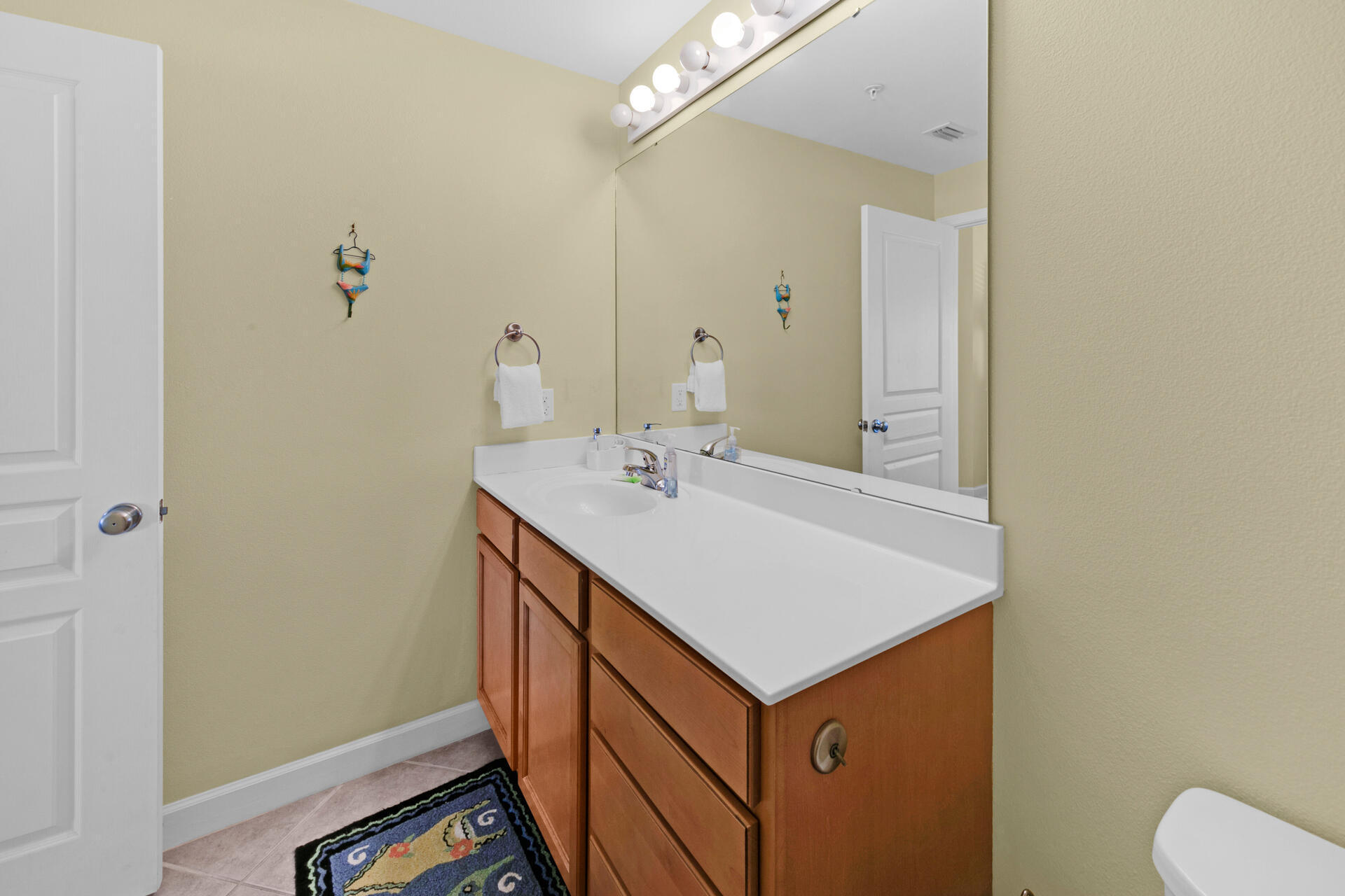 548 Sandy Cay Drive, Unit 309 Miramar Beach, FL 32550 - Photo 10 of 47 a bathroom with a sink a vanity and a mirror