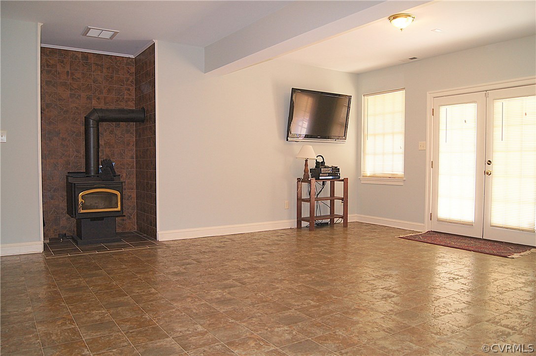 11103 Locust Ridge Place Ashland, VA 23005 - Photo 31 of 50 Rec Room with wood stove opens to rear patio