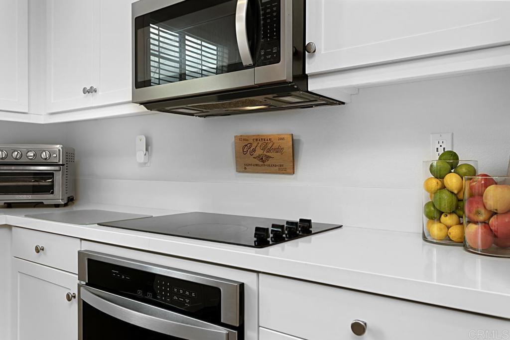 5410 Luna Way Bonsall, CA 92003 - Photo 14 of 37 a kitchen with a stove and a microwave