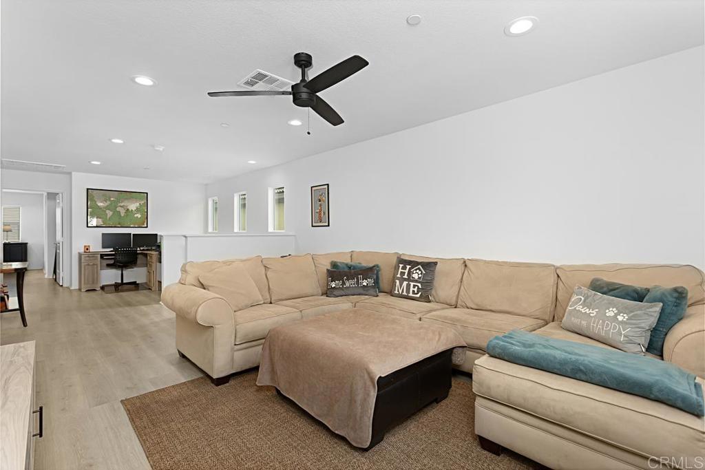 5410 Luna Way Bonsall, CA 92003 - Photo 19 of 37 a living room with furniture and a couch