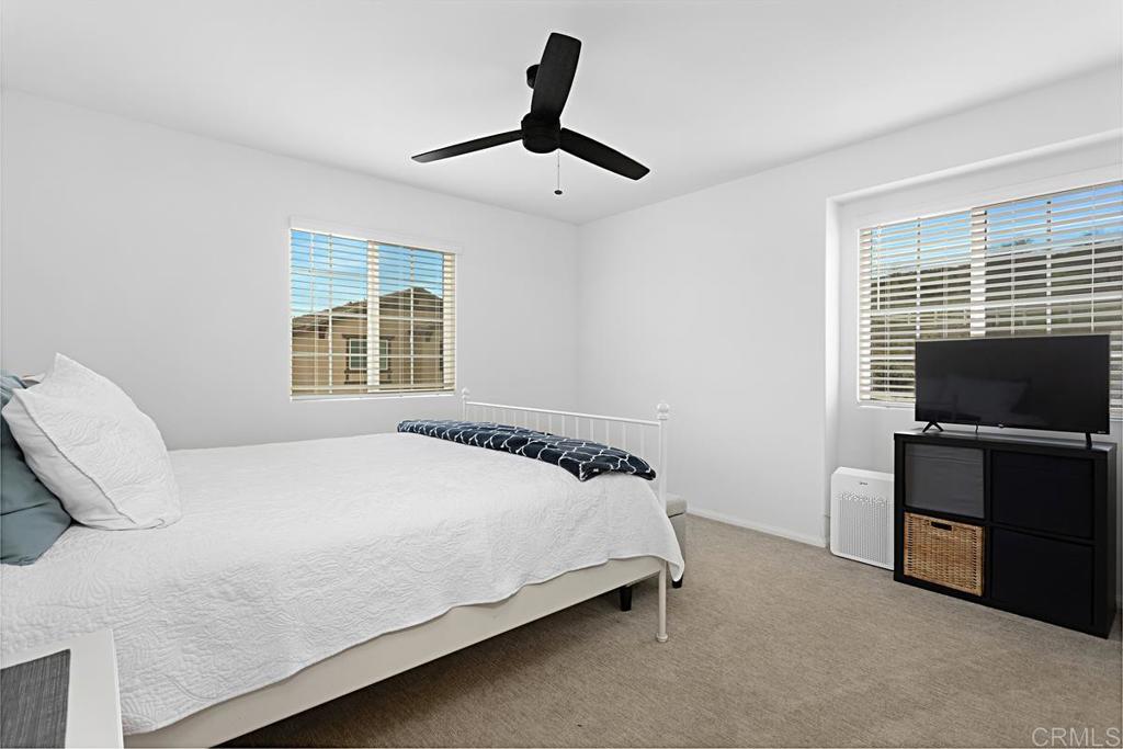 5410 Luna Way Bonsall, CA 92003 - Photo 22 of 37 a bedroom with a bed and a television