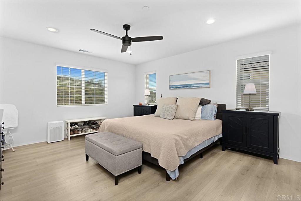 5410 Luna Way Bonsall, CA 92003 - Photo 26 of 37 a bedroom with a large bed and a window