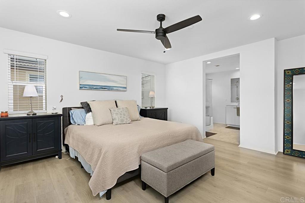 5410 Luna Way Bonsall, CA 92003 - Photo 28 of 37 a spacious bedroom with a bed and ceiling fan