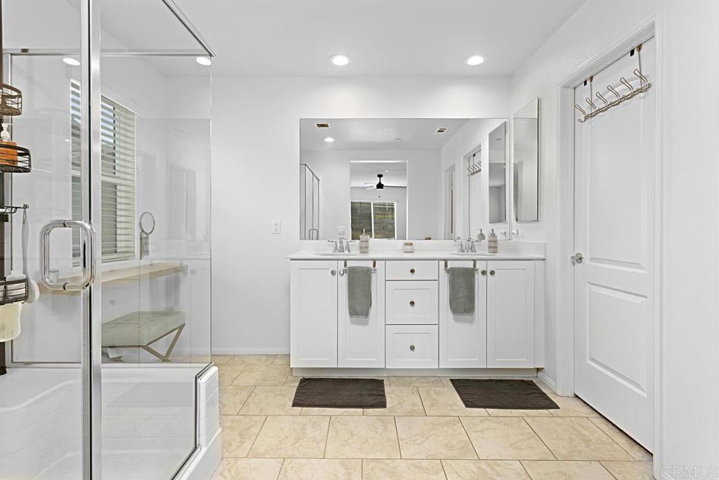 5410 Luna Way Bonsall, CA 92003 - Photo 29 of 37 a bathroom with a sink a toilet and mirror