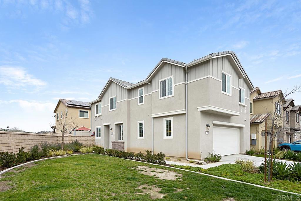 5410 Luna Way Bonsall, CA 92003 - Photo 3 of 37 a front view of a house with a yard