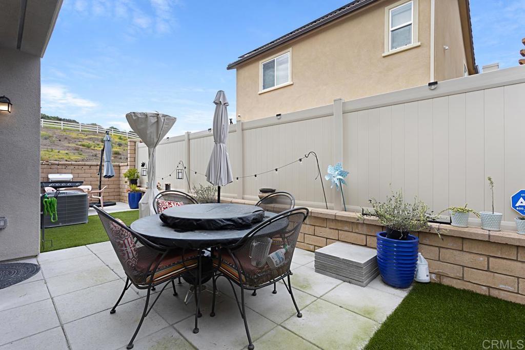 5410 Luna Way Bonsall, CA 92003 - Photo 32 of 37 a table and chairs in front of a building