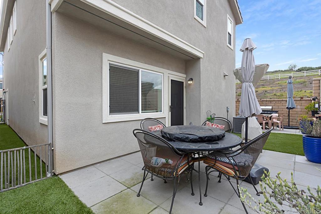 5410 Luna Way Bonsall, CA 92003 - Photo 33 of 37 a patio with table and chairs