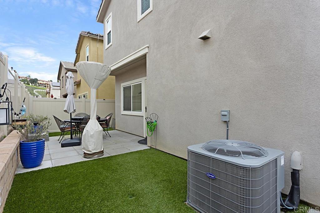 5410 Luna Way Bonsall, CA 92003 - Photo 36 of 37 a front view of a house with garden and chairs