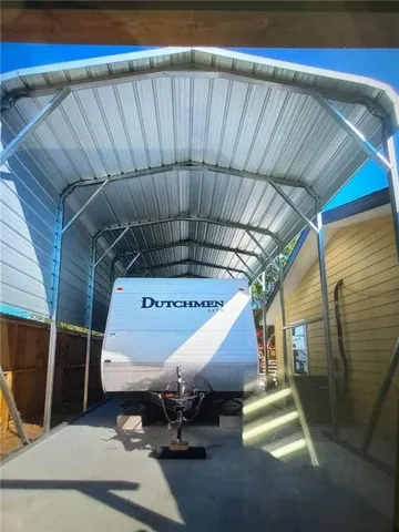 a view of a house with snow on the roof