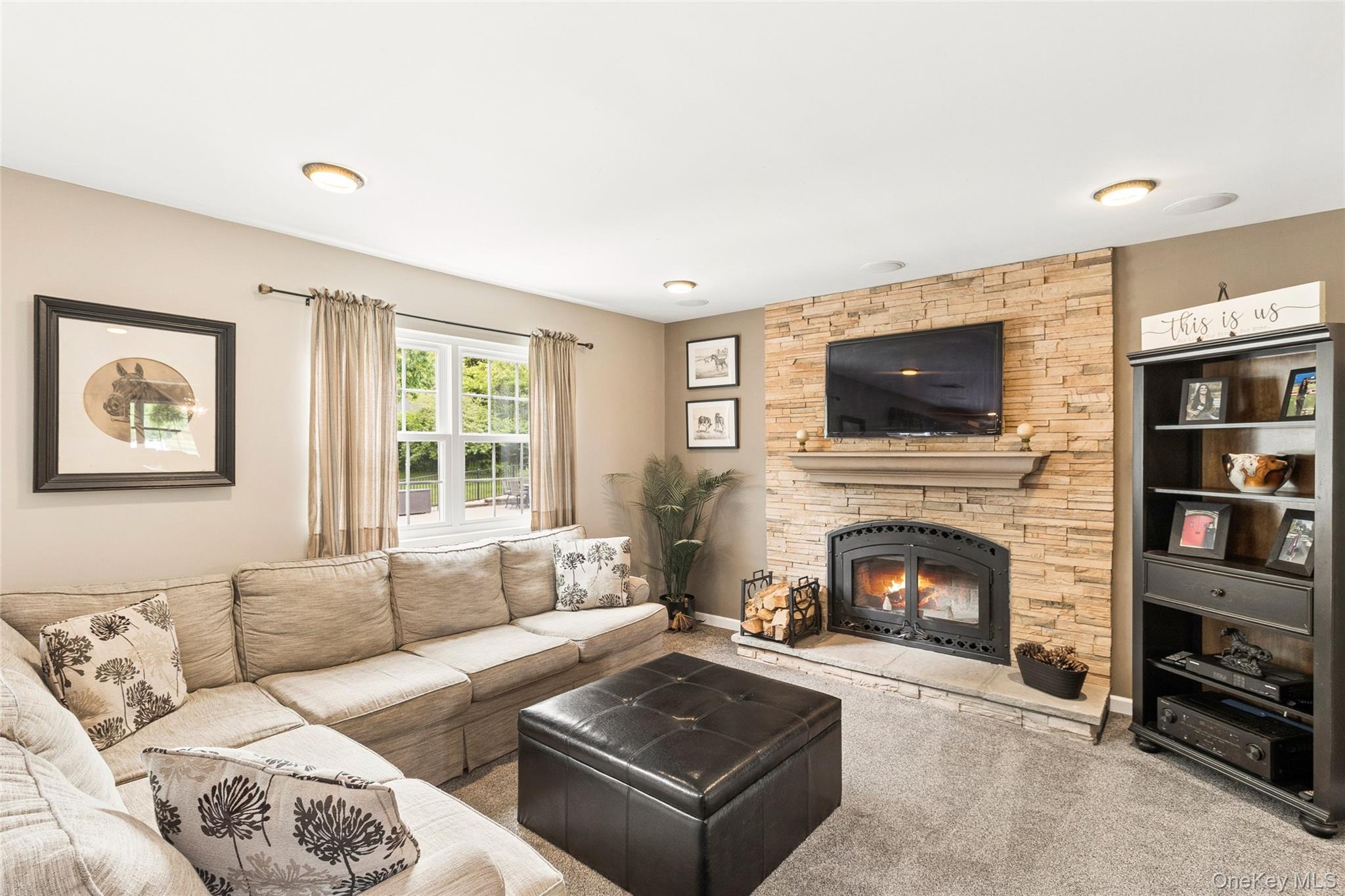 42 Adelia Path Riverhead, NY 11901 - Photo 6 of 30 Living room featuring the fireplace
