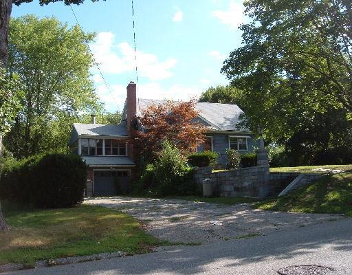 43 Oronoque Road Milford, CT 06461 - Photo 1 of 1 a front view of a house with a garden and plants
